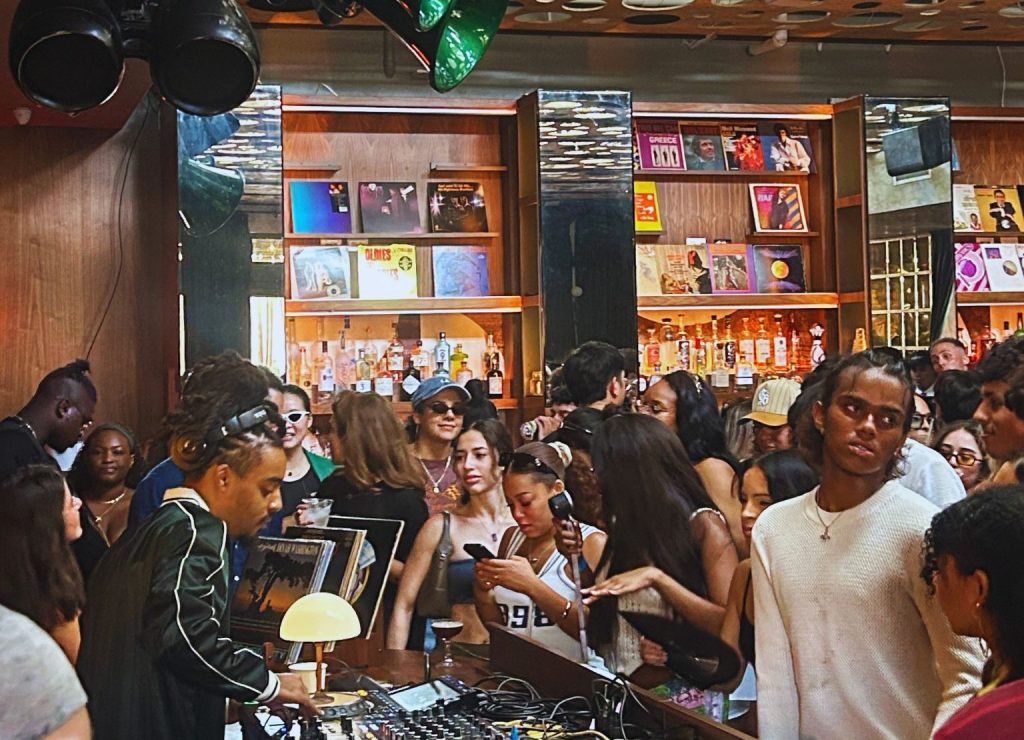 Picture of DJs performing in a room during the day