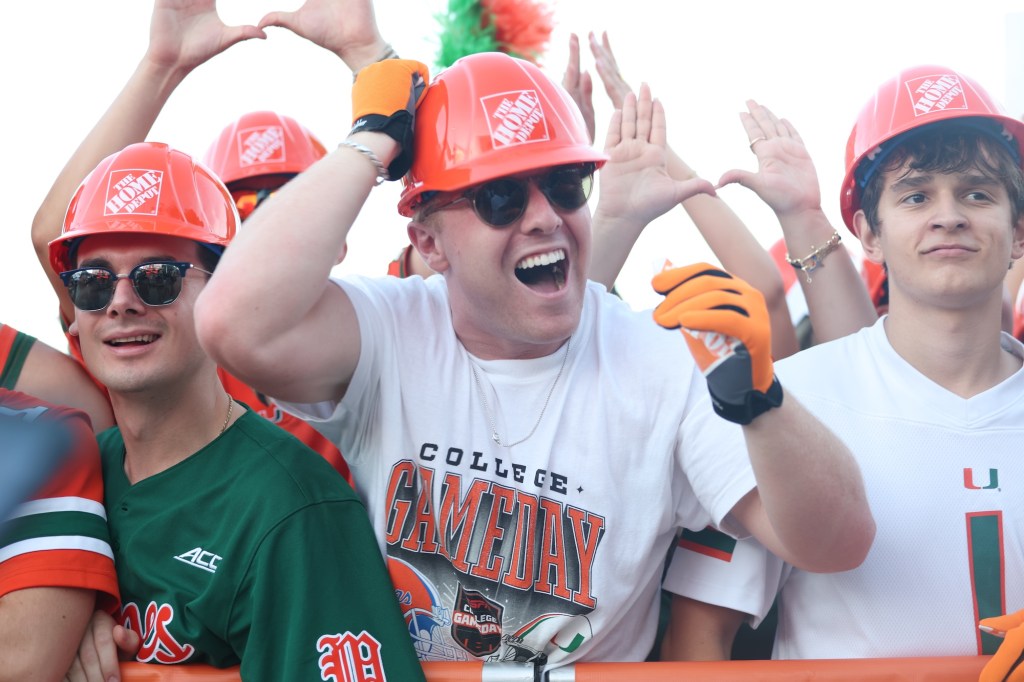 UM fans wearing Home Depot merch helmets