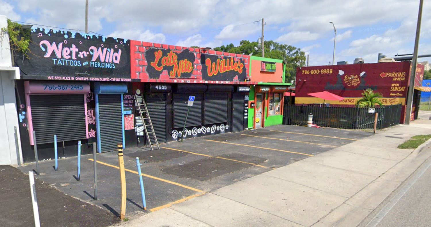Google Streets image of three colorfully pained one-story buildings.