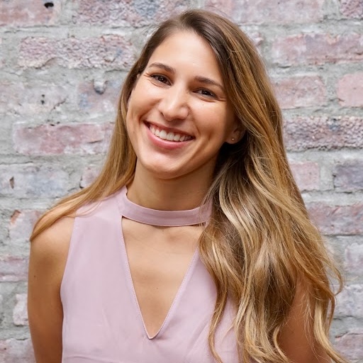 photo of a smiling young woman with long blond hair