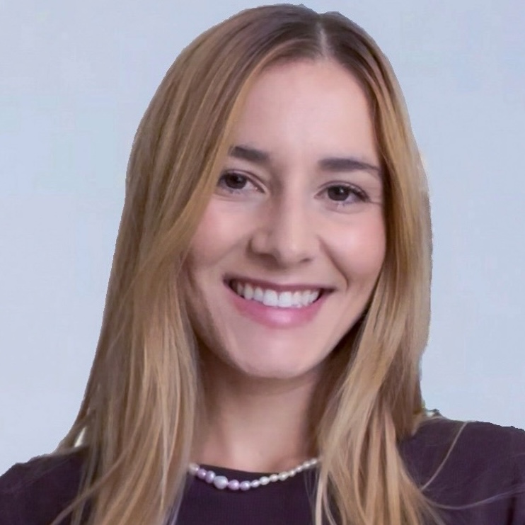 headshot of a smiling young woman with straight blond hair