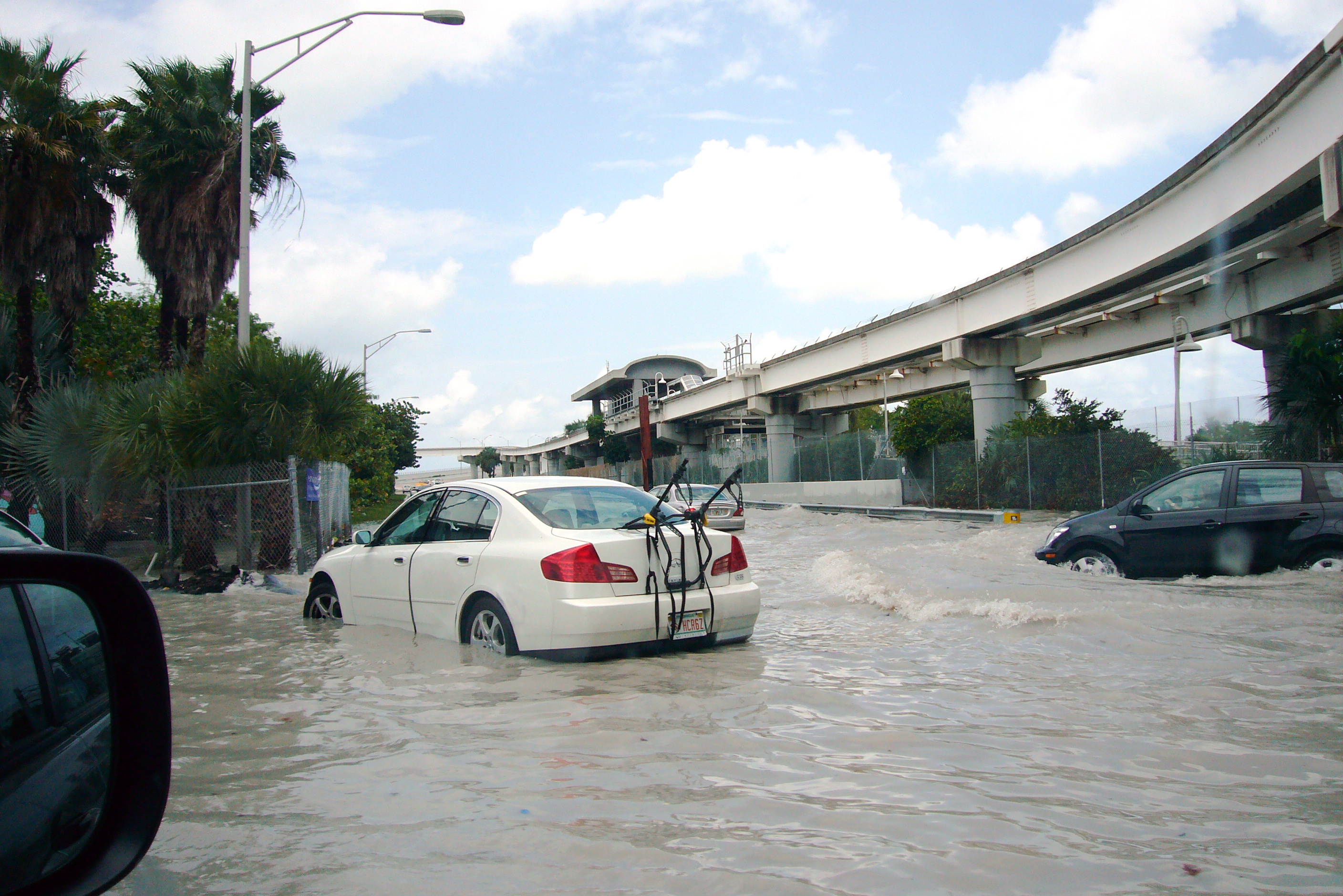 Depicted is a street inundated with rain water