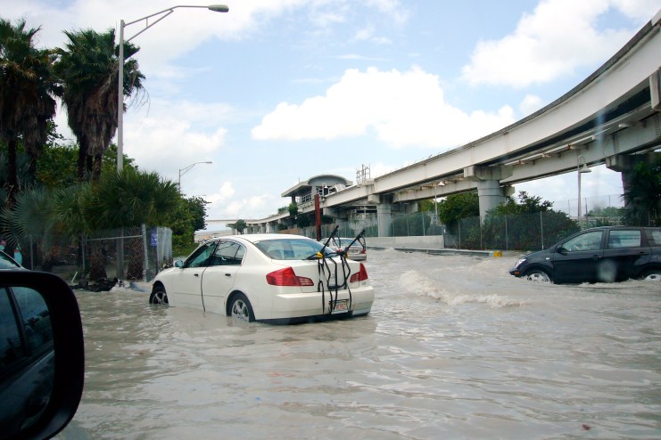 Depicted is a street inundated with rain water