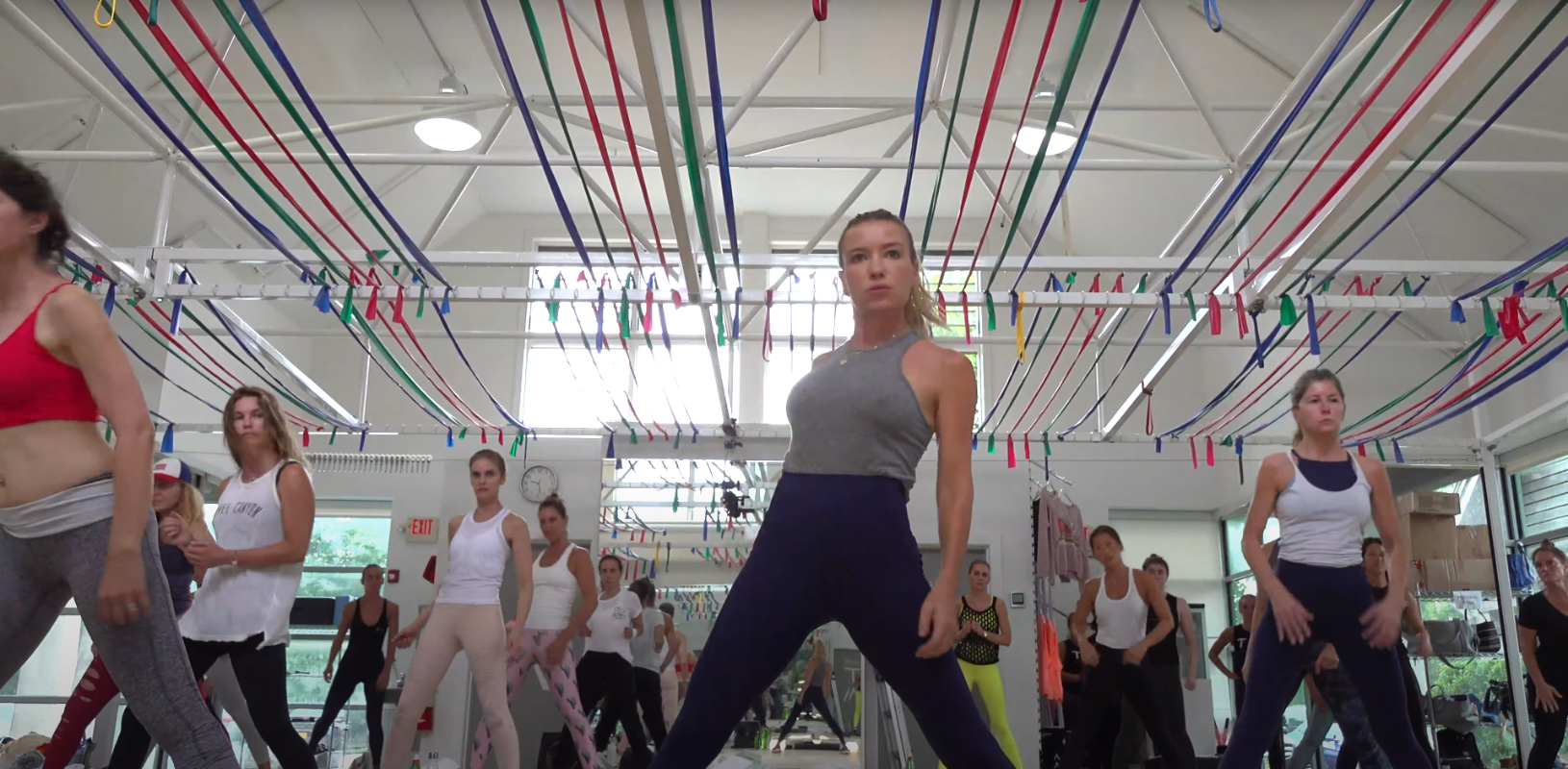 A fitness instructor leads a class.