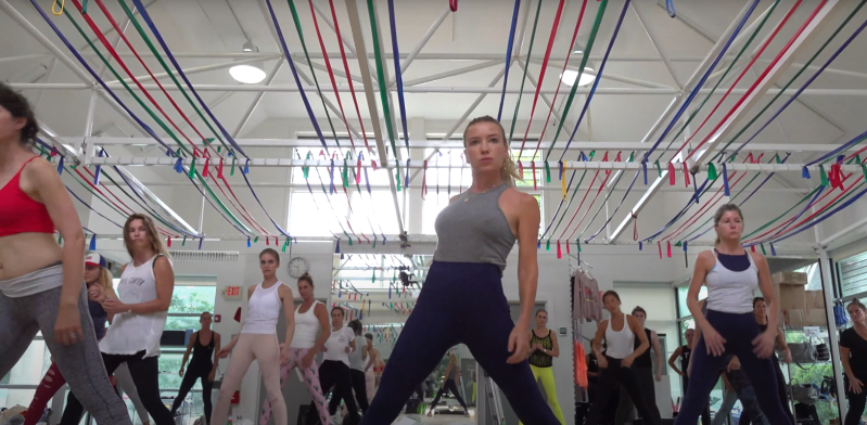 A fitness instructor leads a class.