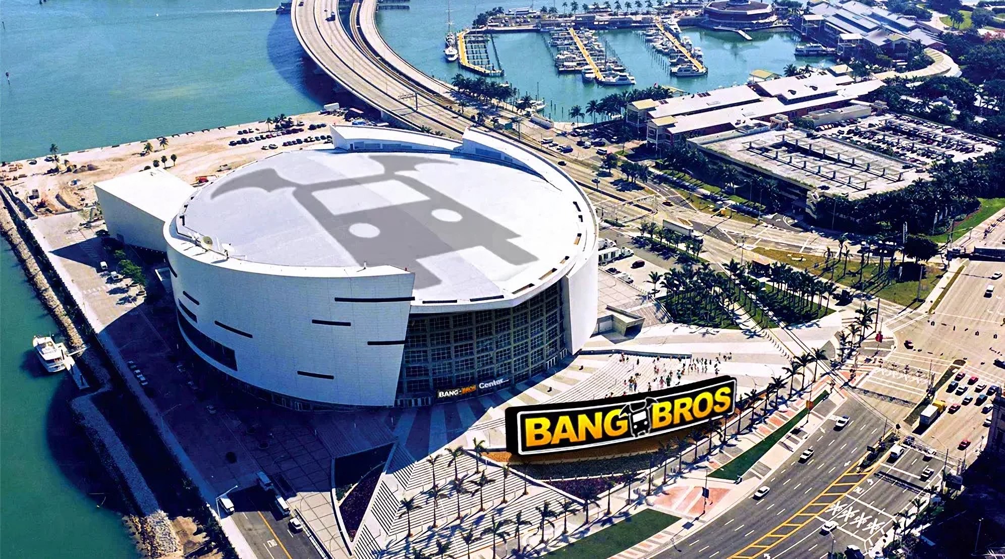 Aerial view of the home of the Miami Heat altered to show the logo of porn production company BangBros on the roof and signage.