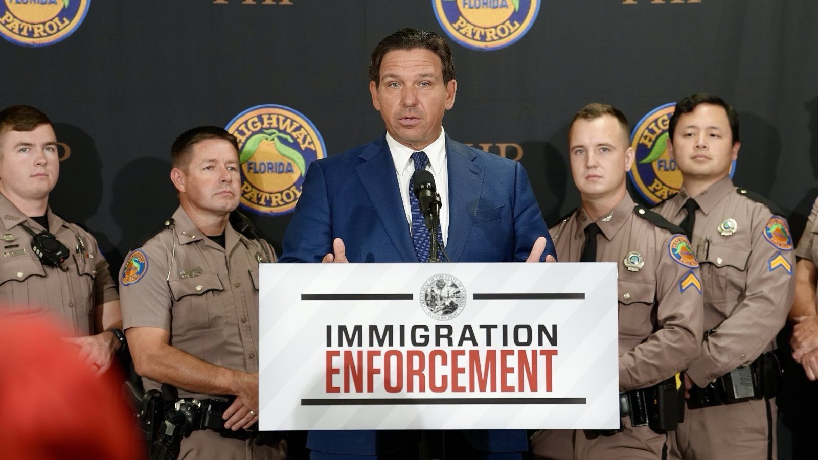 Ron DeSantis stands at press conference with Florida Highway Patrol officers next to him