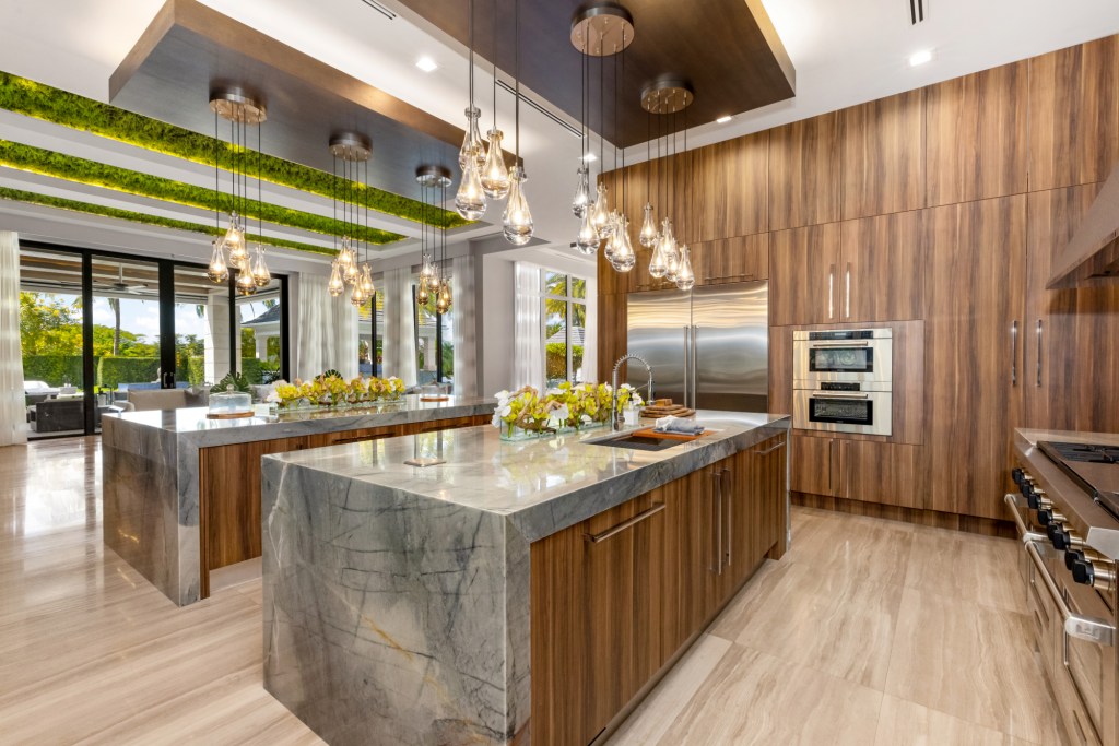 Kitchen with wood cabinets and marble countertops