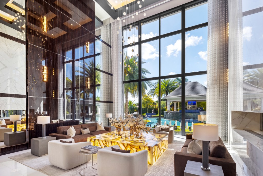 Living room next to floor to ceiling windows to look out into the backyard