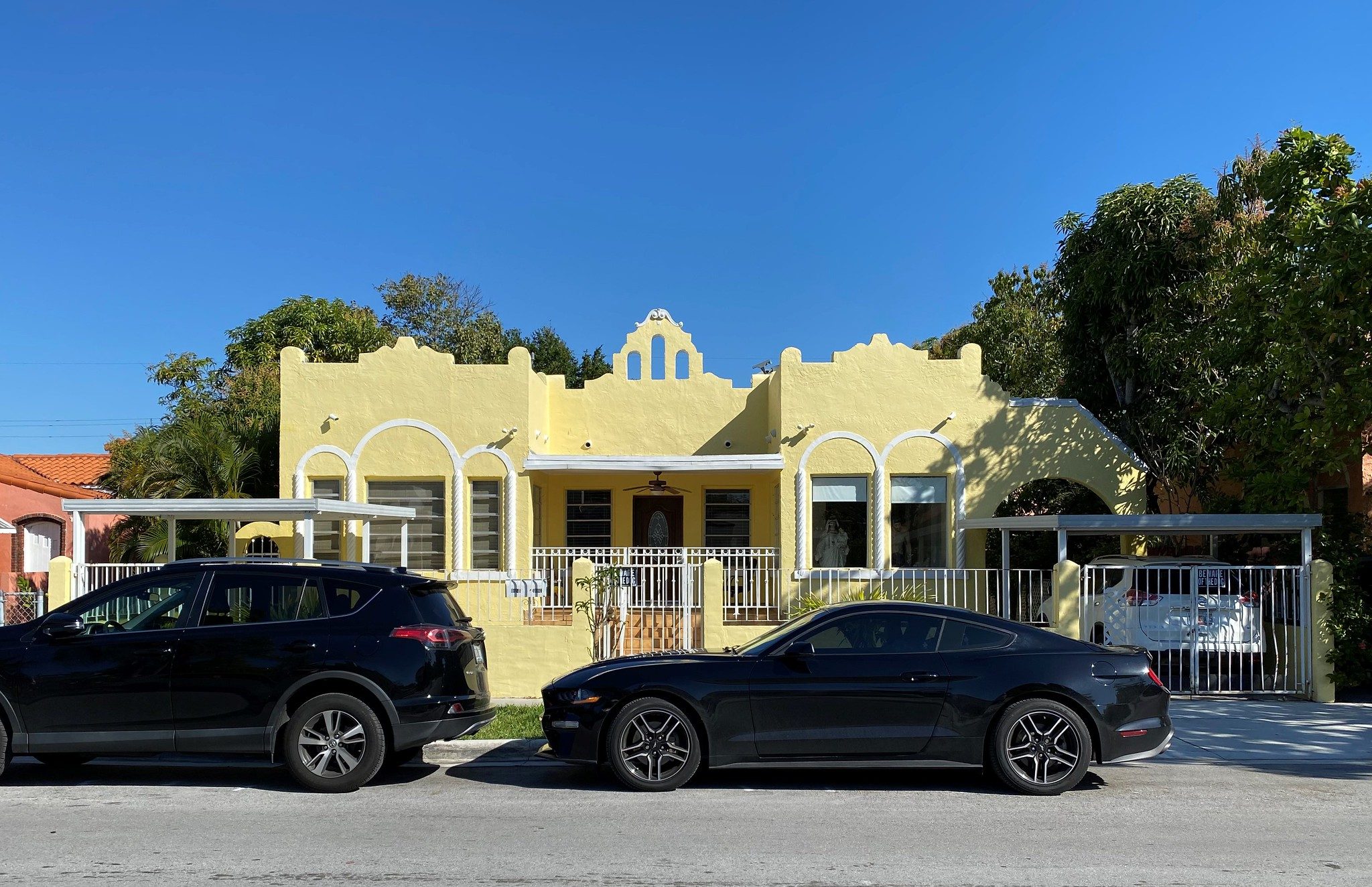 a yellow one-story house in Miami's Shenandoah neighborhood, likely dating to the pre WWII period