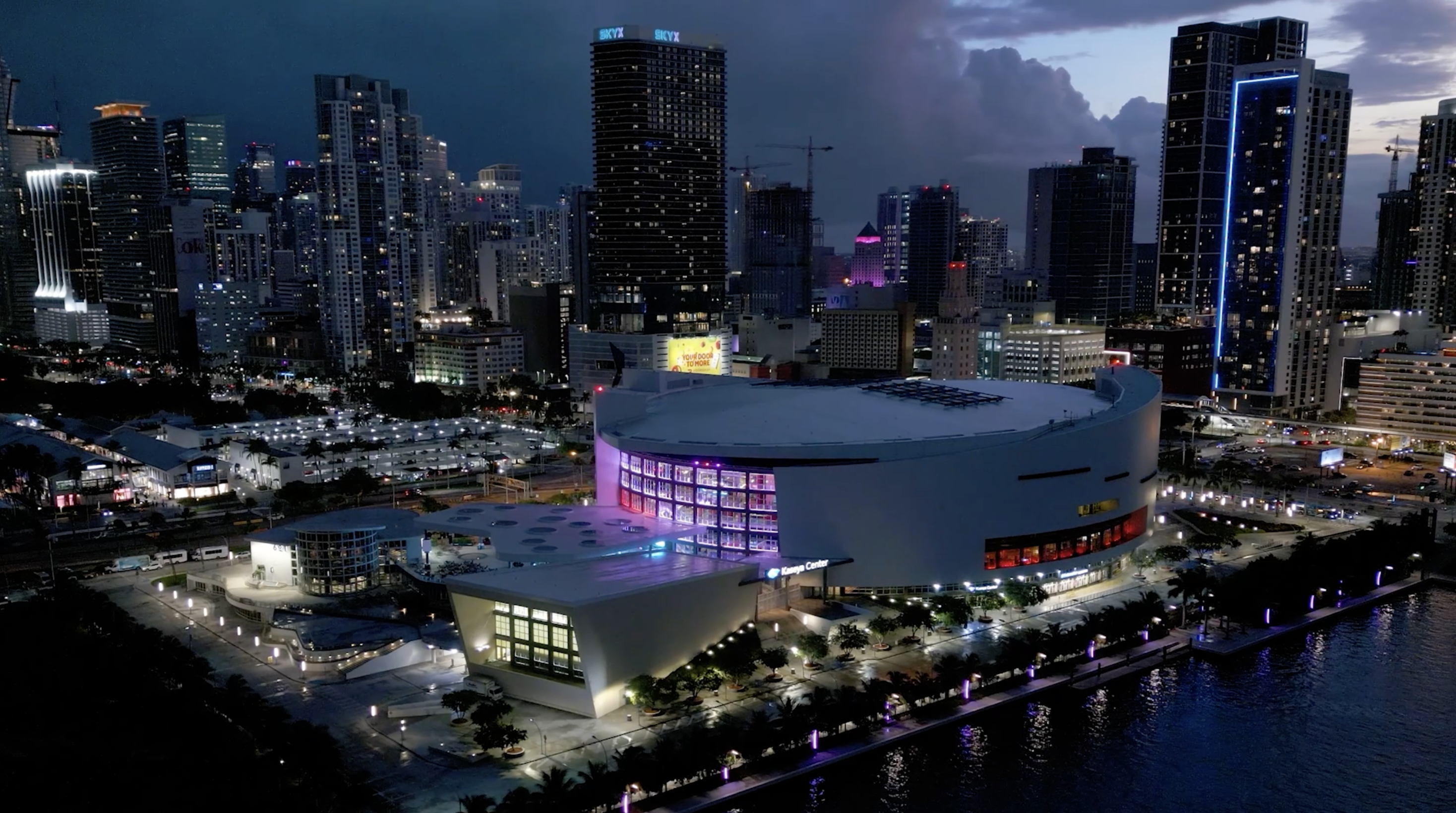 aerial view of Miami's Kaseya Center arena with the city skyline behind it