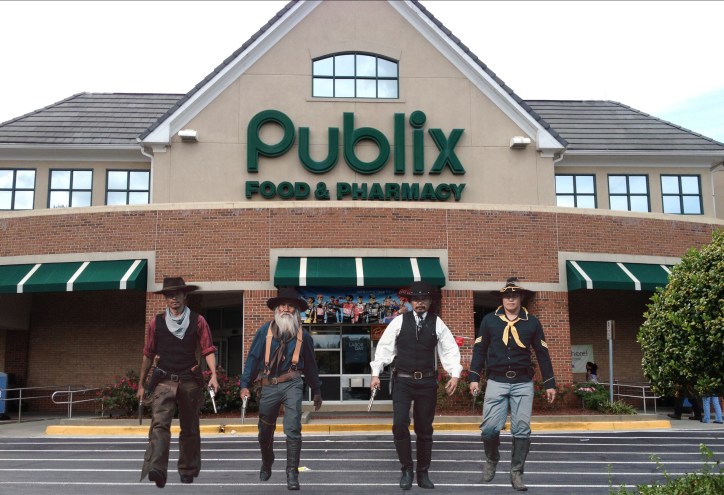 A photoshopped image of cowboys leaving a Publix store.