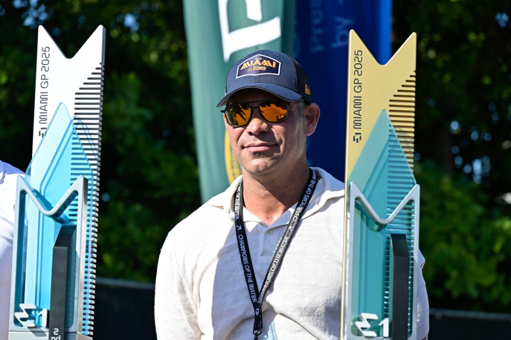 photo of Miami Mayor Francis Suarez in a baseball cap, shades, and a white t-shirt at an outdoor sporting event