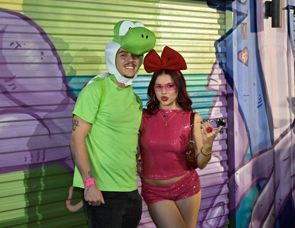 photo of a couple dressed as Nintendo characters Yoshi and Birdo for Halloween