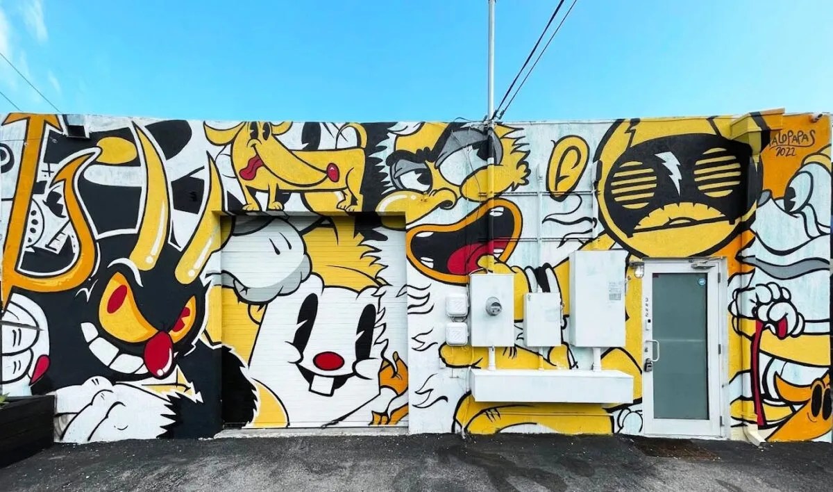 a yellow mural outside a radio station in Miami