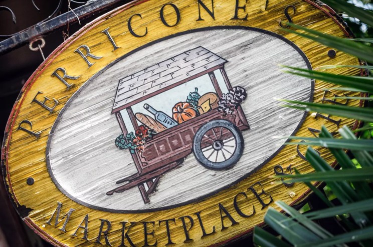 A yellow sign and leaves