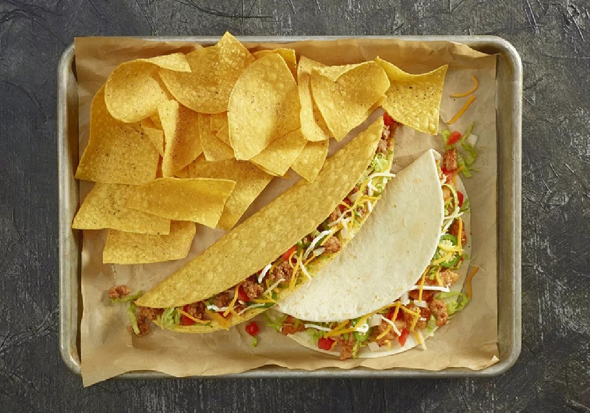 Tacos and tortilla chips on platter