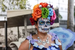 Woman painting as a sugar skull