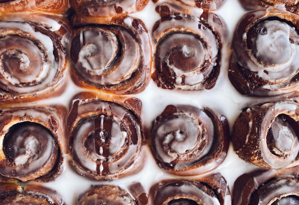 Cinnamon rolls drizzle with glaze at Zak the Baker