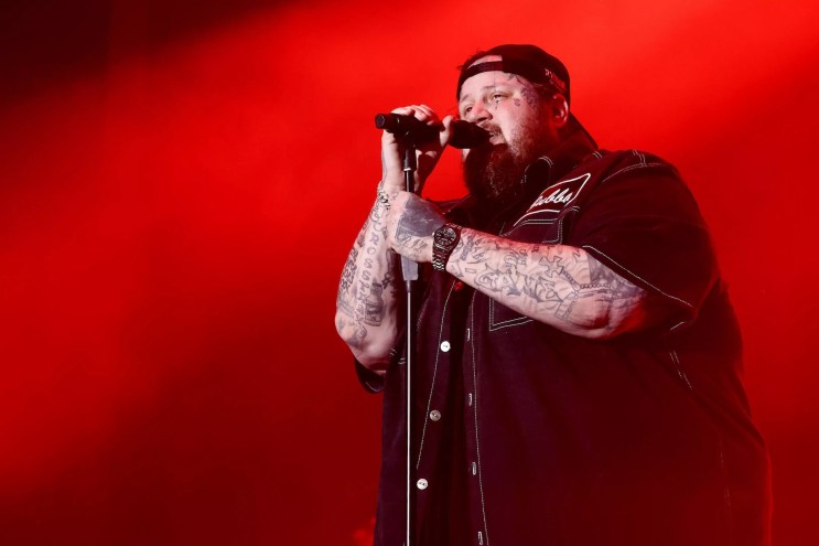 Country singer Jelly Roll singing on stage at the Riptide Music Festival in Fort Lauderdale Beach