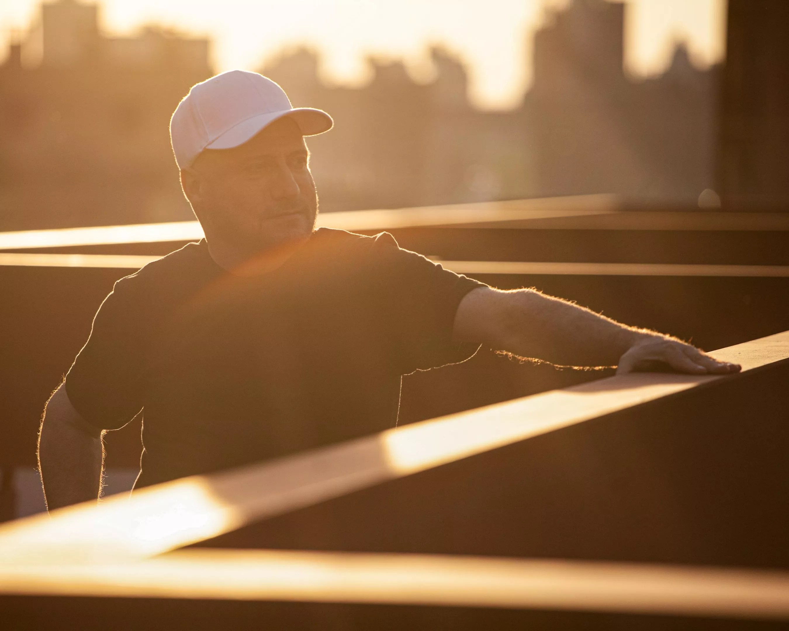 DJ Danny Tenaglia stands on a rooftop, basking in the sunlight