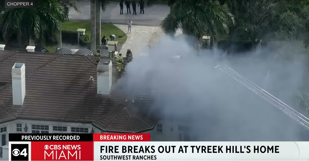 Smoke billows from a fire at an NFL player's mansion