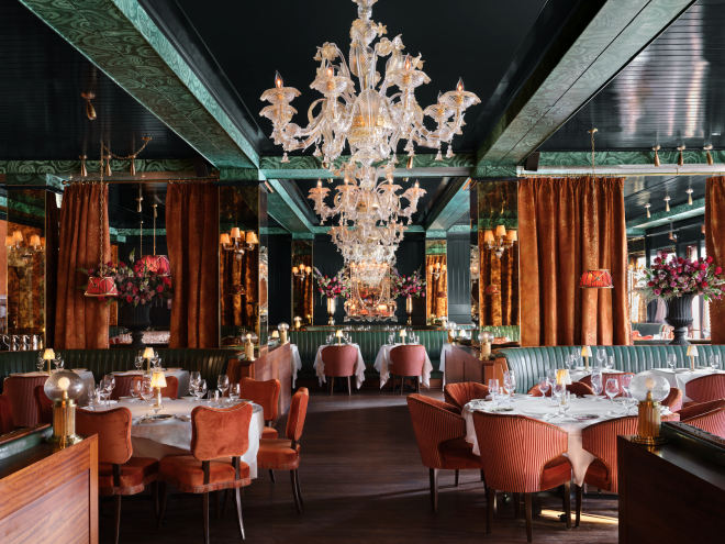 Carbone Miami Beach's opulent dining room with chandelier