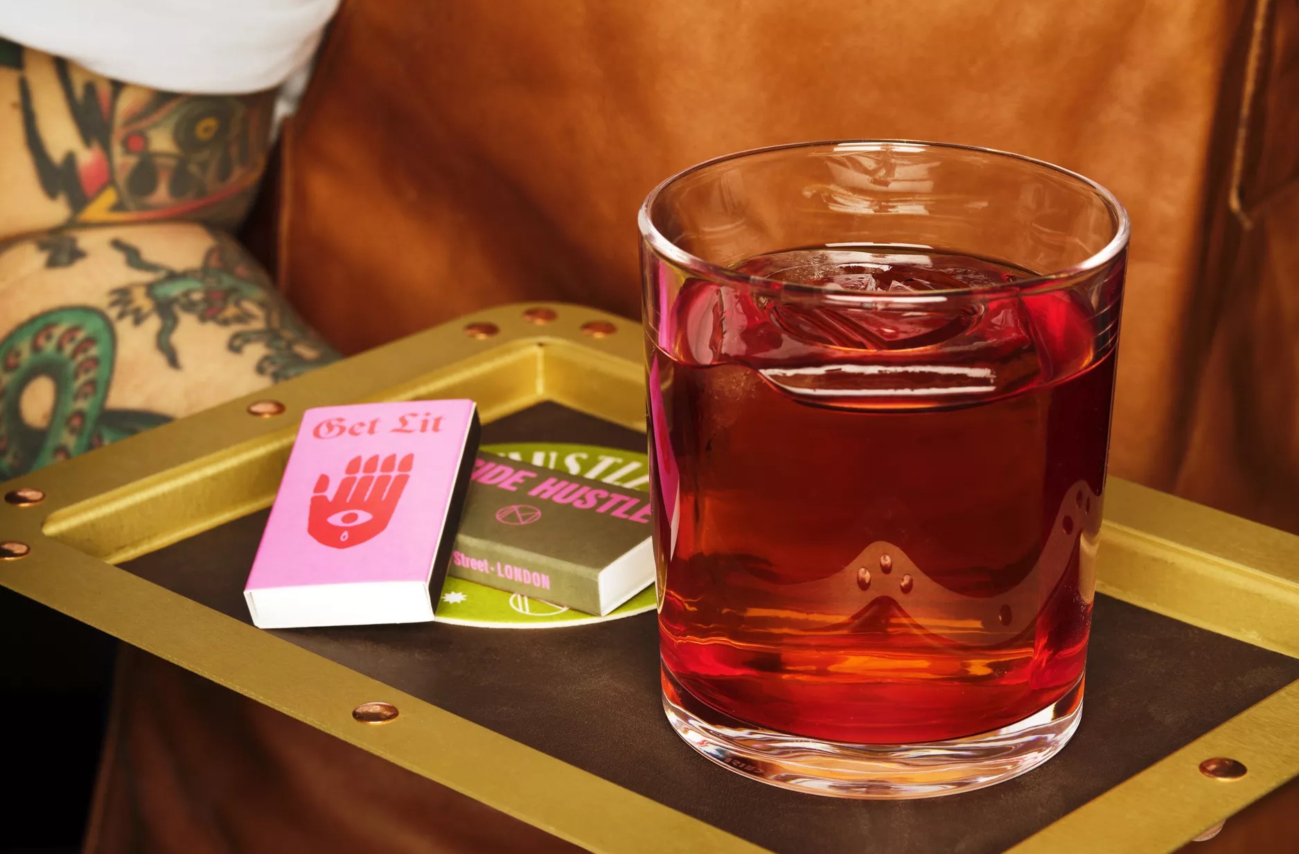 Negroni in a glass next to matches