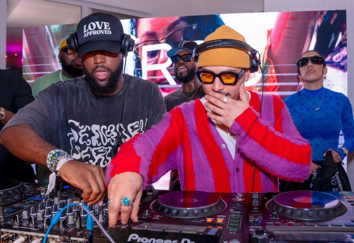 Leslie "Aya" Ayafor and Joe Kay DJing in front of the decks