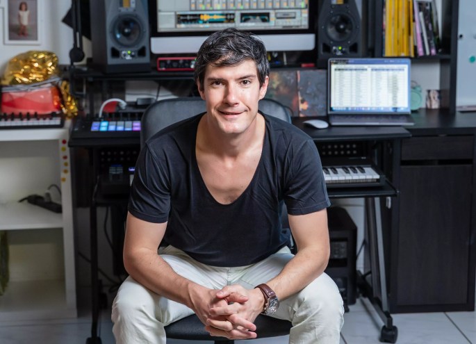 Predrag Pedja Kovačević sitting in a chair in his music studio