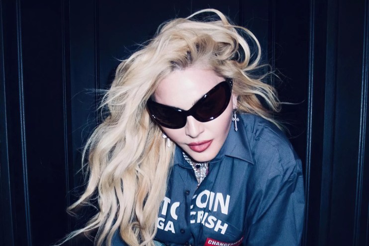 Portrait of Madonna with long blonde hair and sunglasses