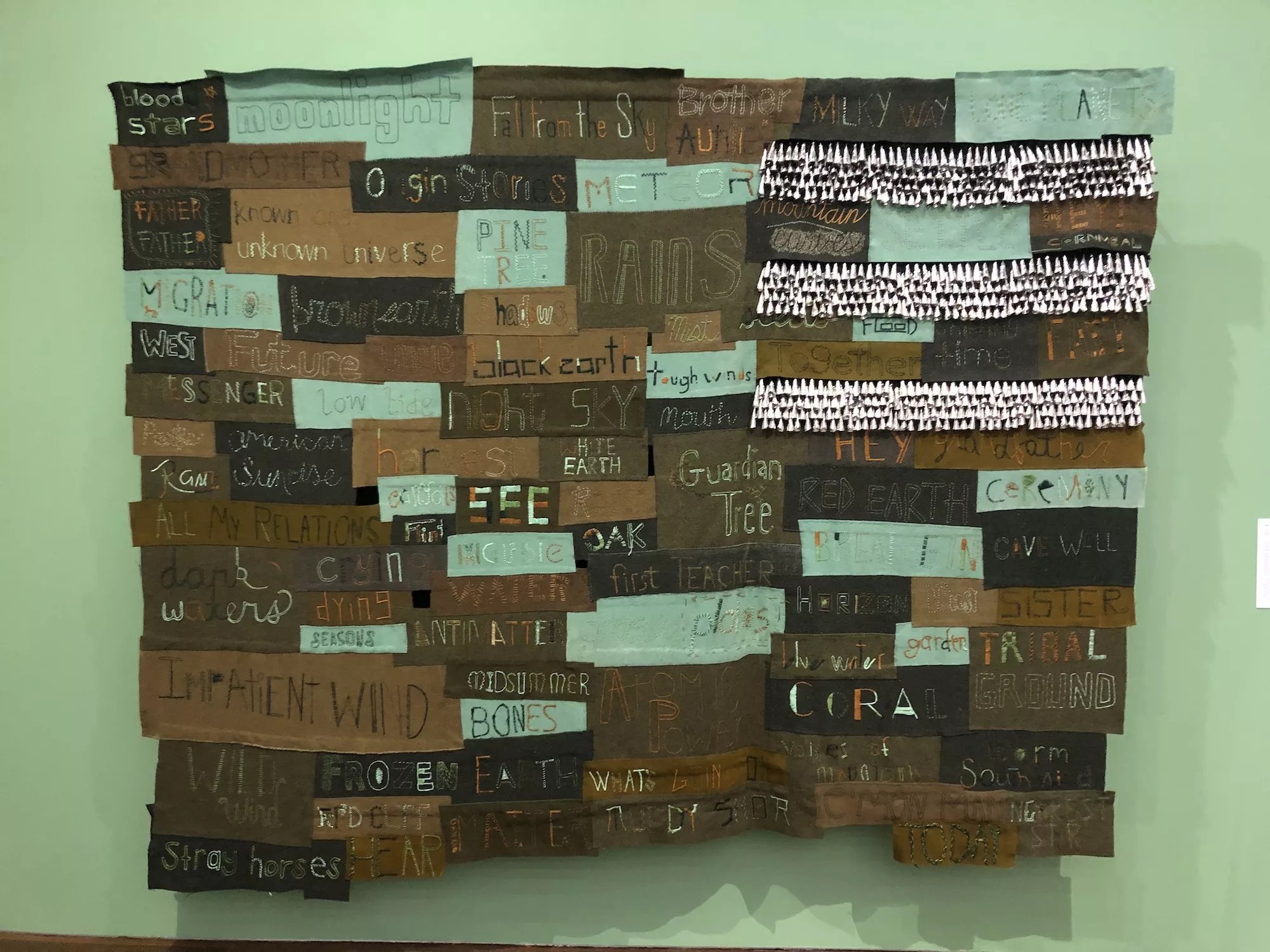 Word etched and painted on wooden boards