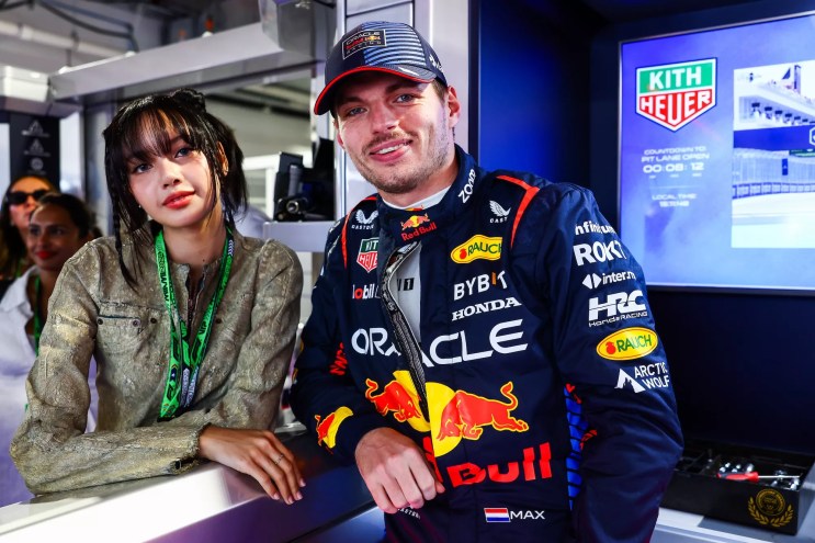 Lisa from Blackpink posing with Dutch driver Max Verstappen at Miami Grand Prix