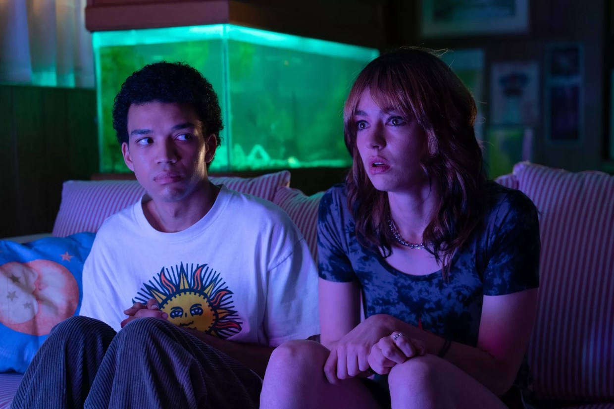 Still of Justice Smith and Brigette Lundy-Paine still on a couch