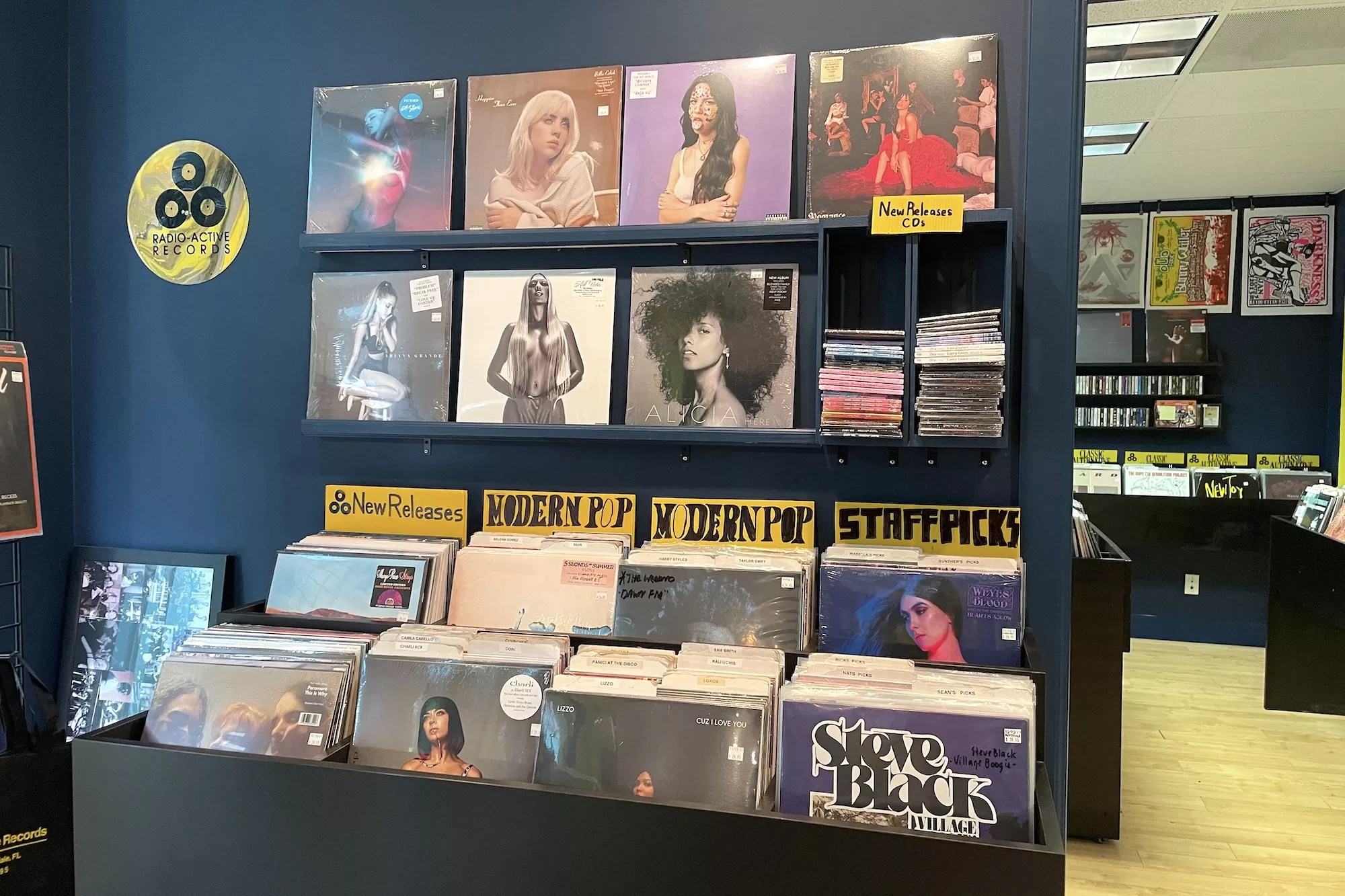 The wall and bin of new vinyl albums at Radio-Active Records