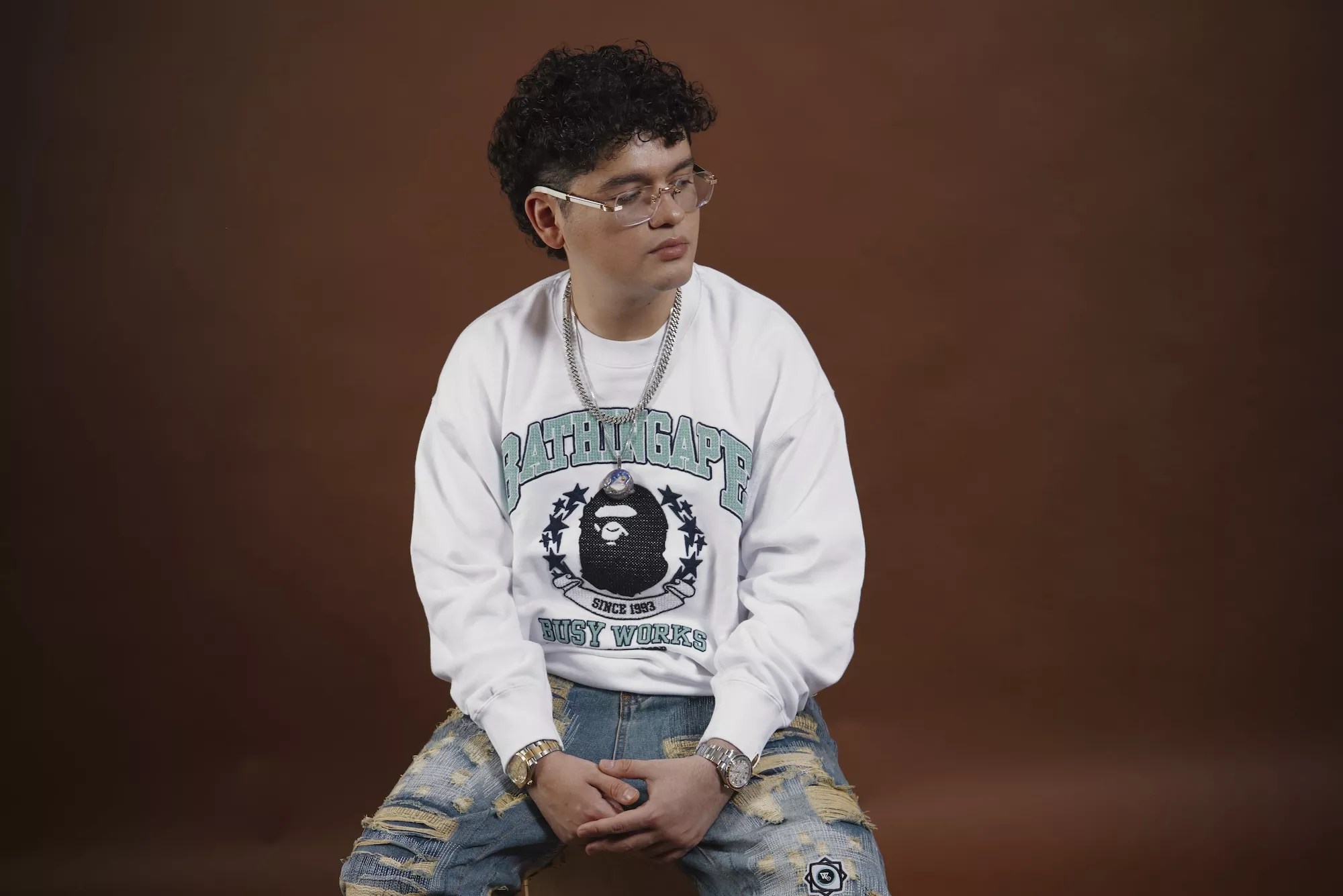 Portrait of Jasiel Nuñez in a Bathing Ape sweatshirt