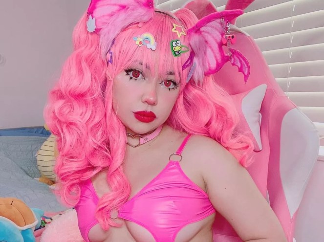 Kirbii Casablancas in a pink wig and pink bikini top
