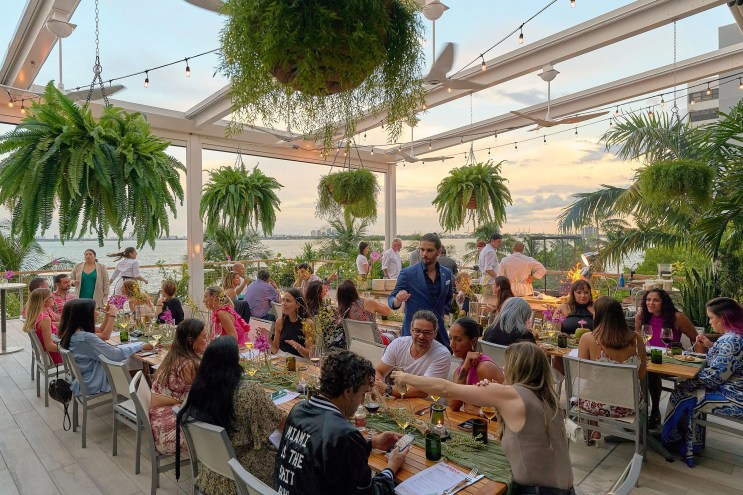Group of people at the outdoor dining area at Amara at Paraiso