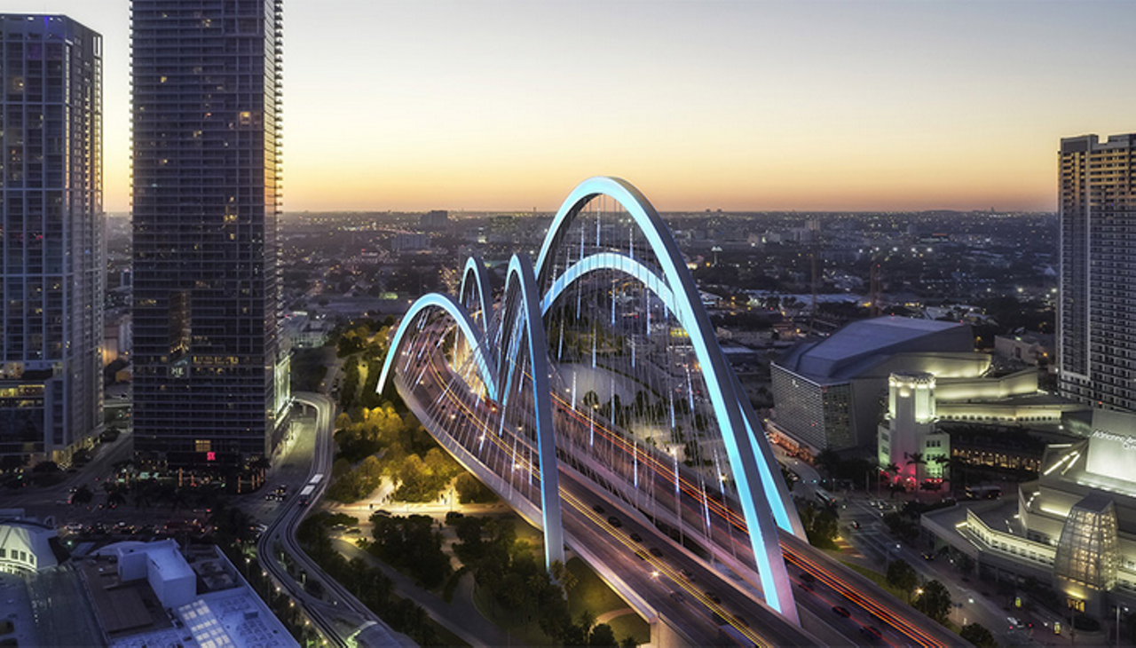 Conceptual image of towering arches over a downtown Miami highway, part of the Signature Bridge project