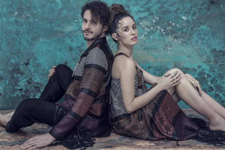 the two members of monsieur perine sitting back to back