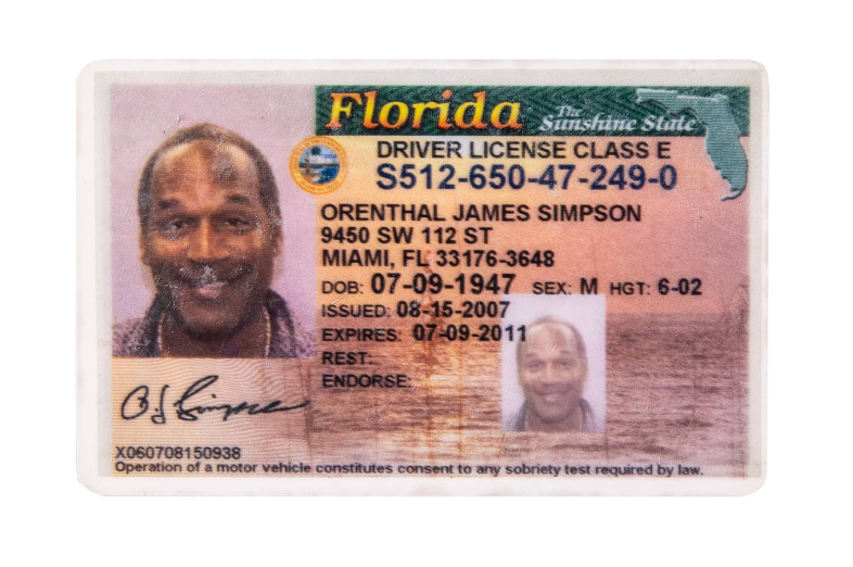 O.J. Simpson's expired driver's license, with Simpson's smile visible under scuff marks