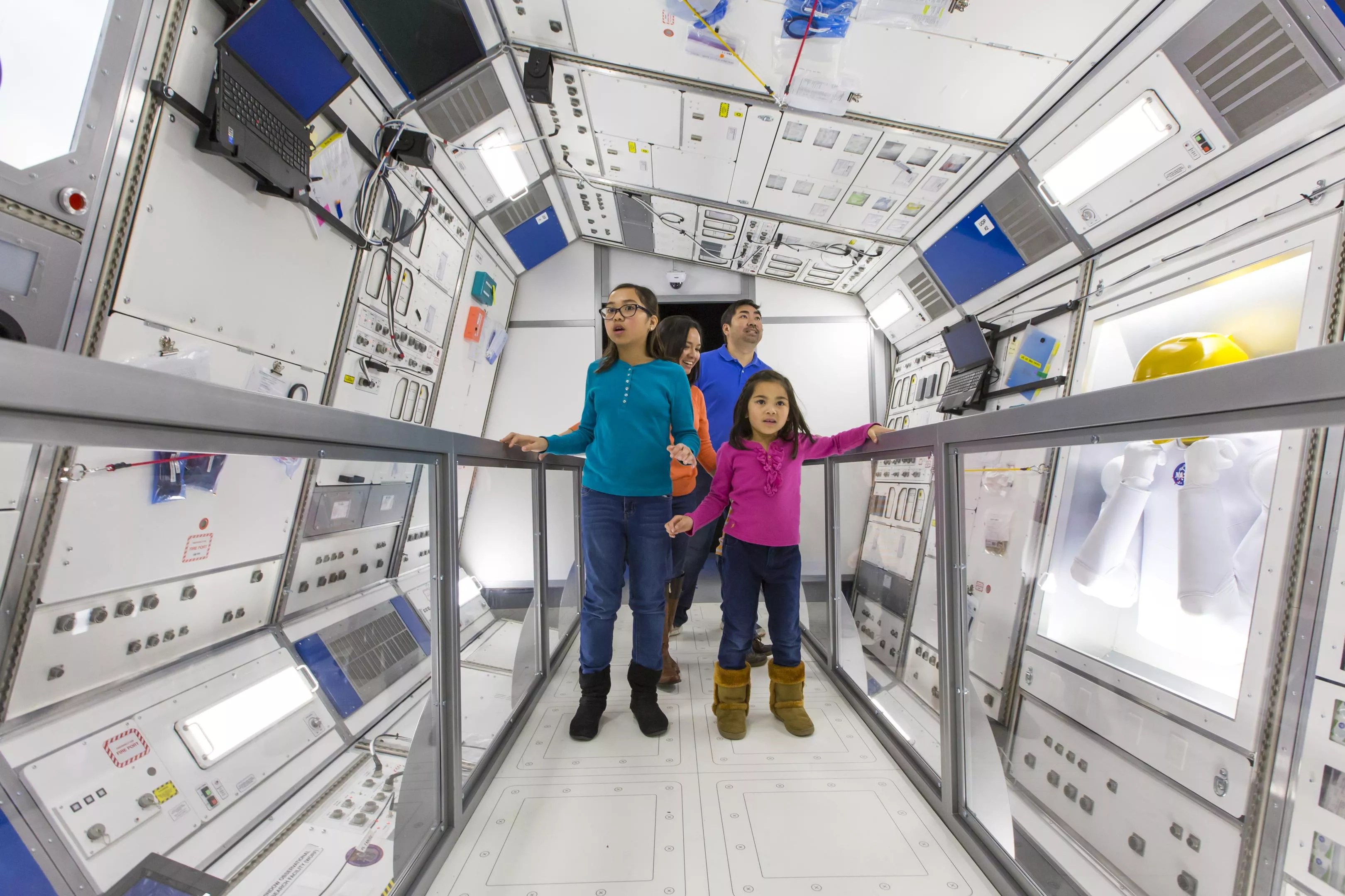 A family exploring the "Journey to Space" exhibition