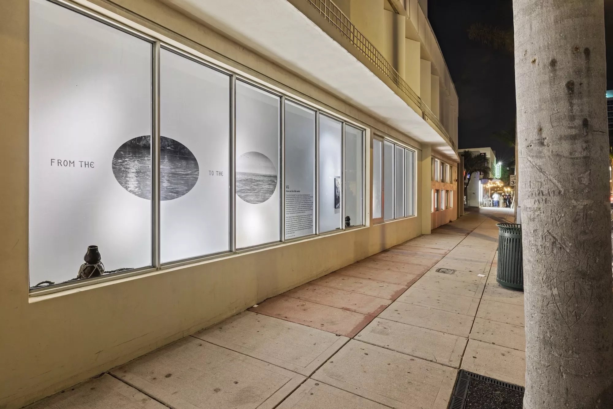 Vũ Hoàng Khánh Nguyên's How we live like water in the window display of a Miami Beach Walgreens