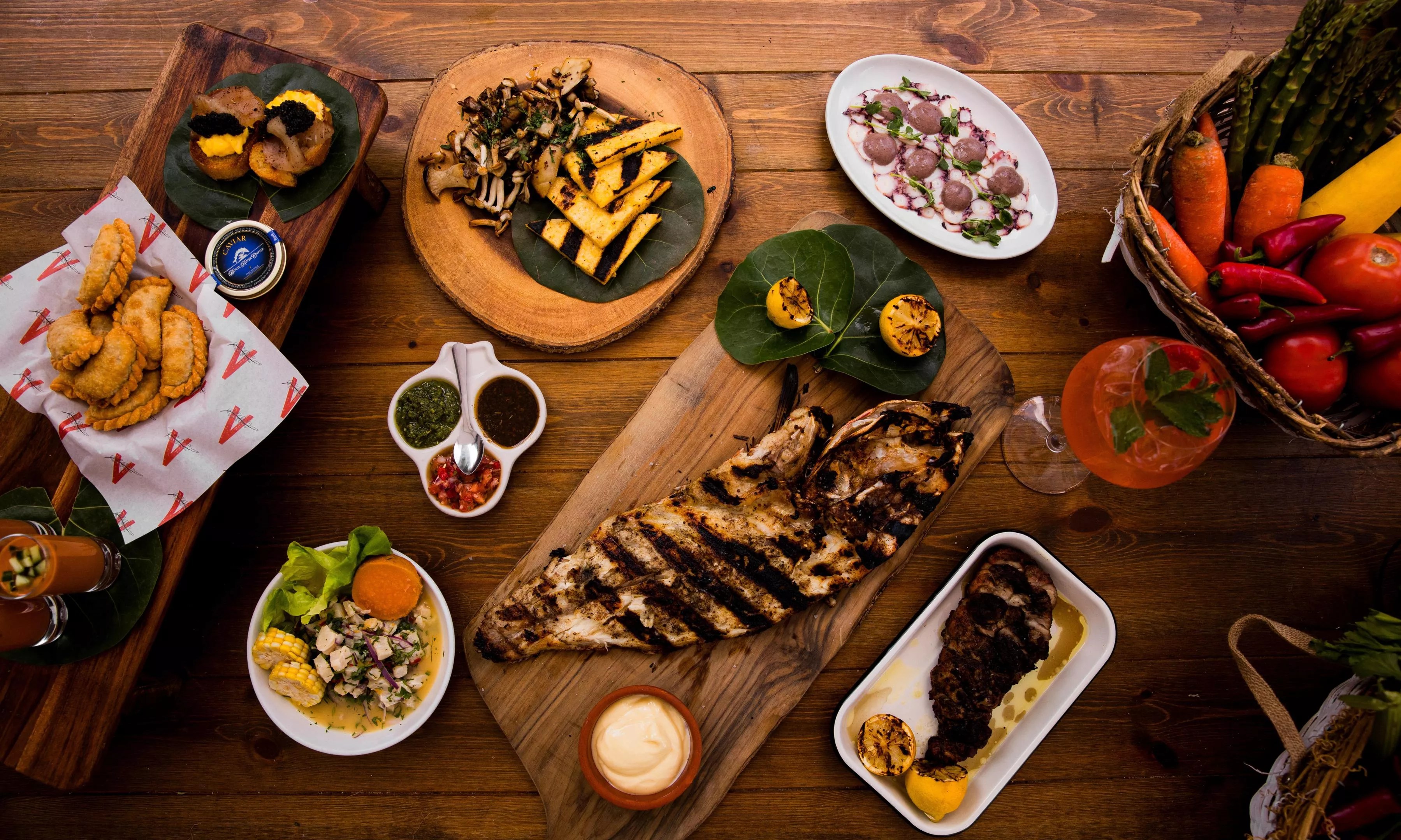 A spread of dishes on a wooden table
