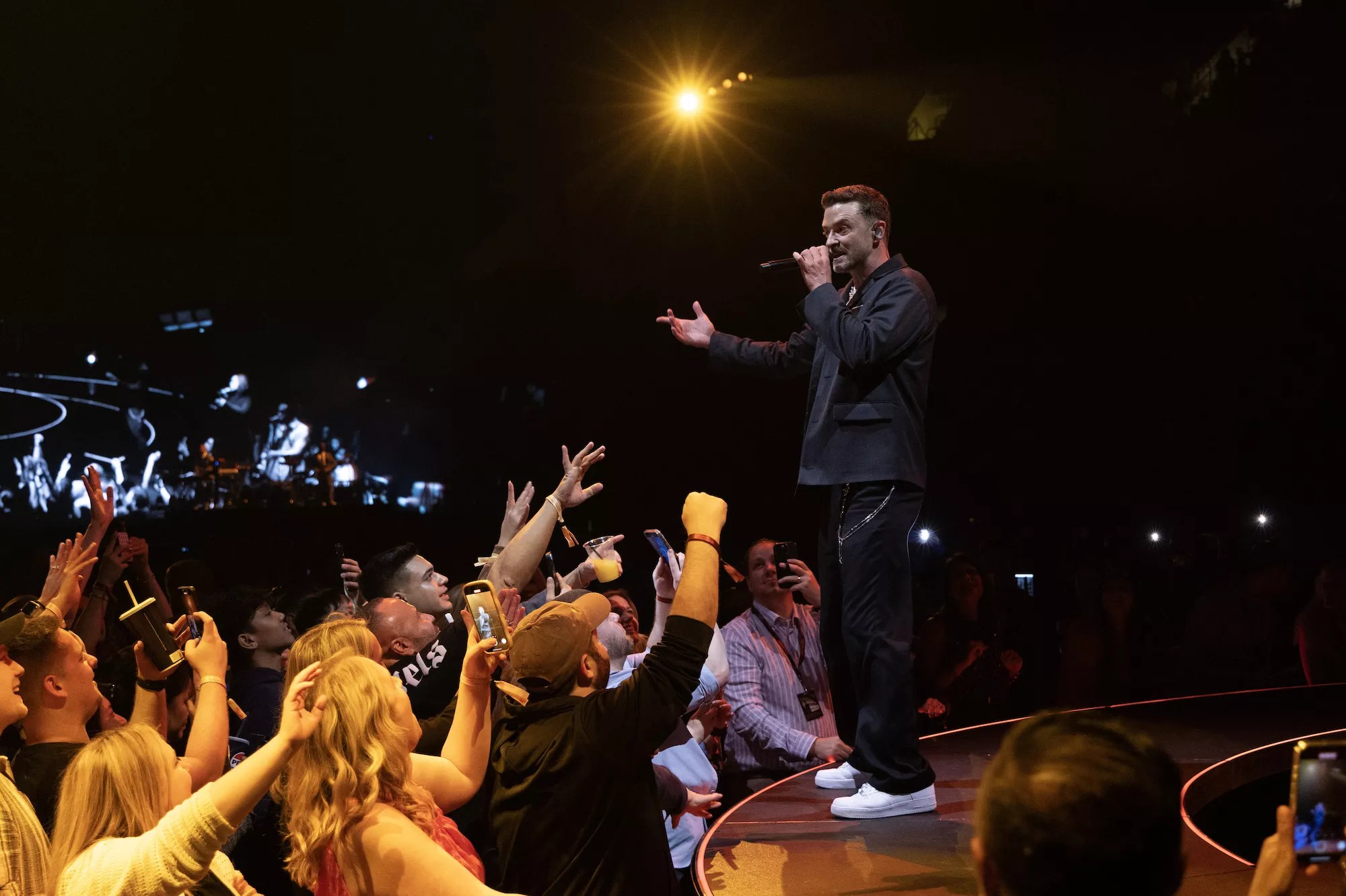 Justin Timberlake singing before the crowd at the Kaseya Center
