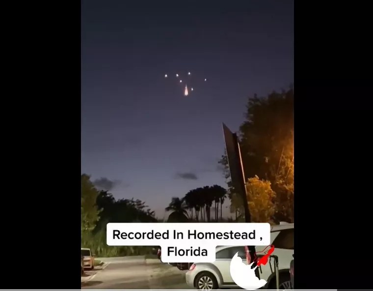 A group of lights break apart and stay suspended in the air over Homestead