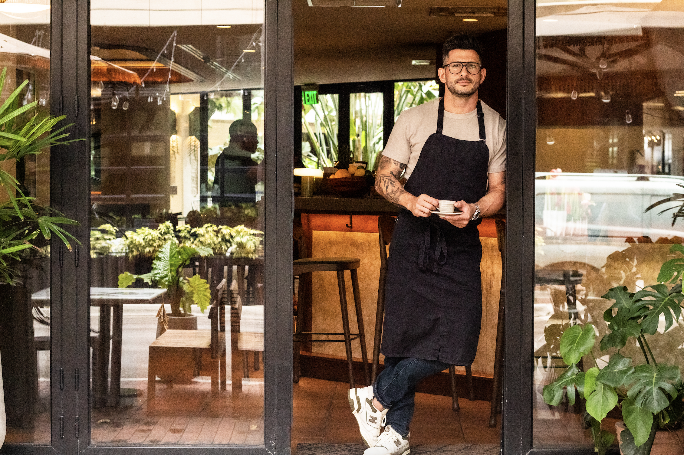 a man posing against wall