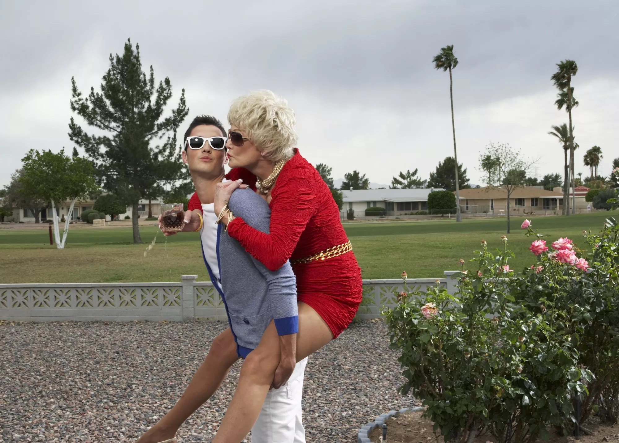 Older woman on the back of a younger man