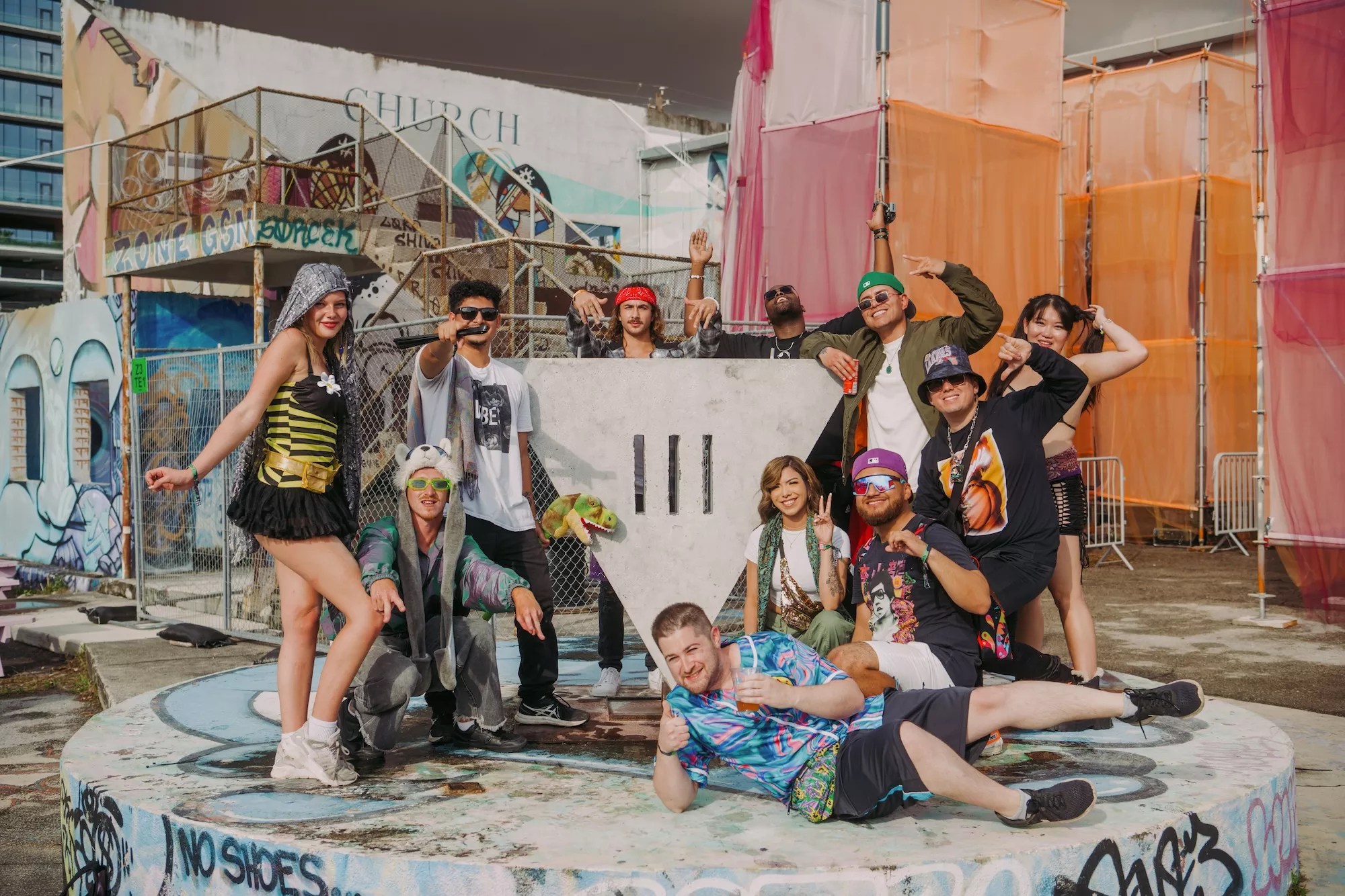 Festivalgoers posing for a photo by the III Points logo