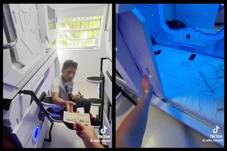 Ellis Rayson hands over cash for a night's lodging in a sleep pod at the Capsule Hotel.